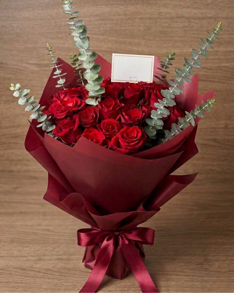 Luxury Pure Romance Bouquet with premium red roses and eucalyptus wrapped elegantly for romantic flower delivery in Dubai and UAE