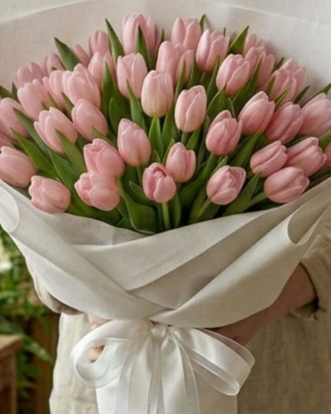 Pink Tulip Bouquet with white wrapping, showcasing 50 fresh pink tulips arranged elegantly.