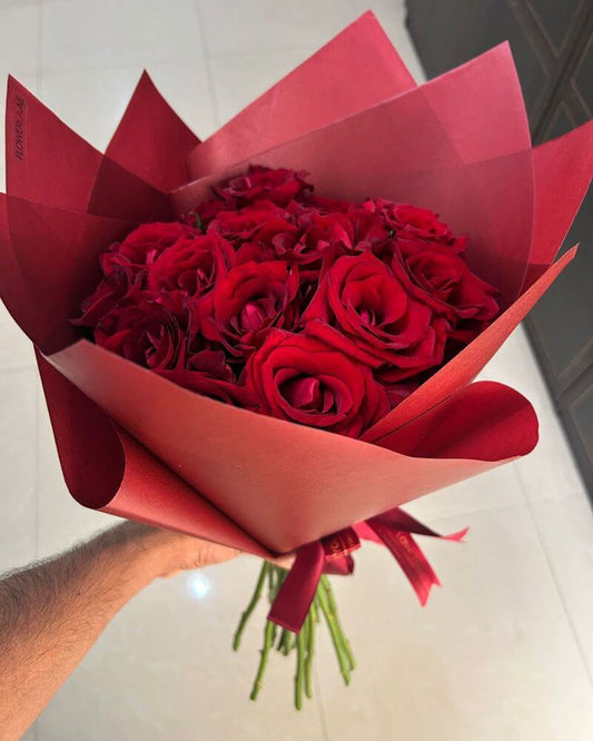 15 Red Roses Classic Bouquet wrapped in elegant red paper for romantic occasions